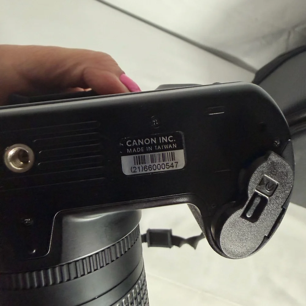 Canon Black Digital Camera with Lens and Strap